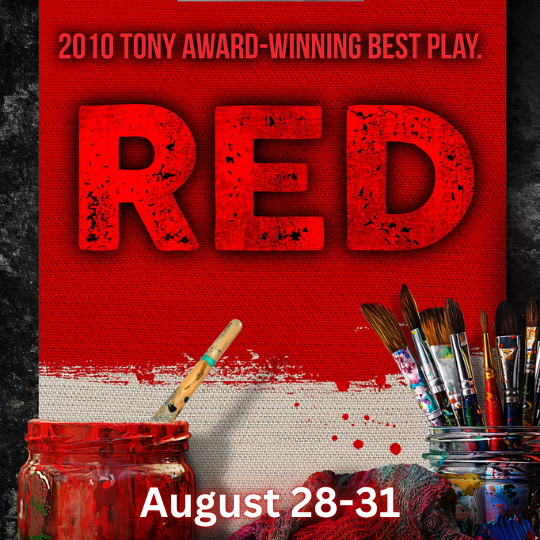 Painted canvas with the word Red on it. Paintbrushes surround the canvas.